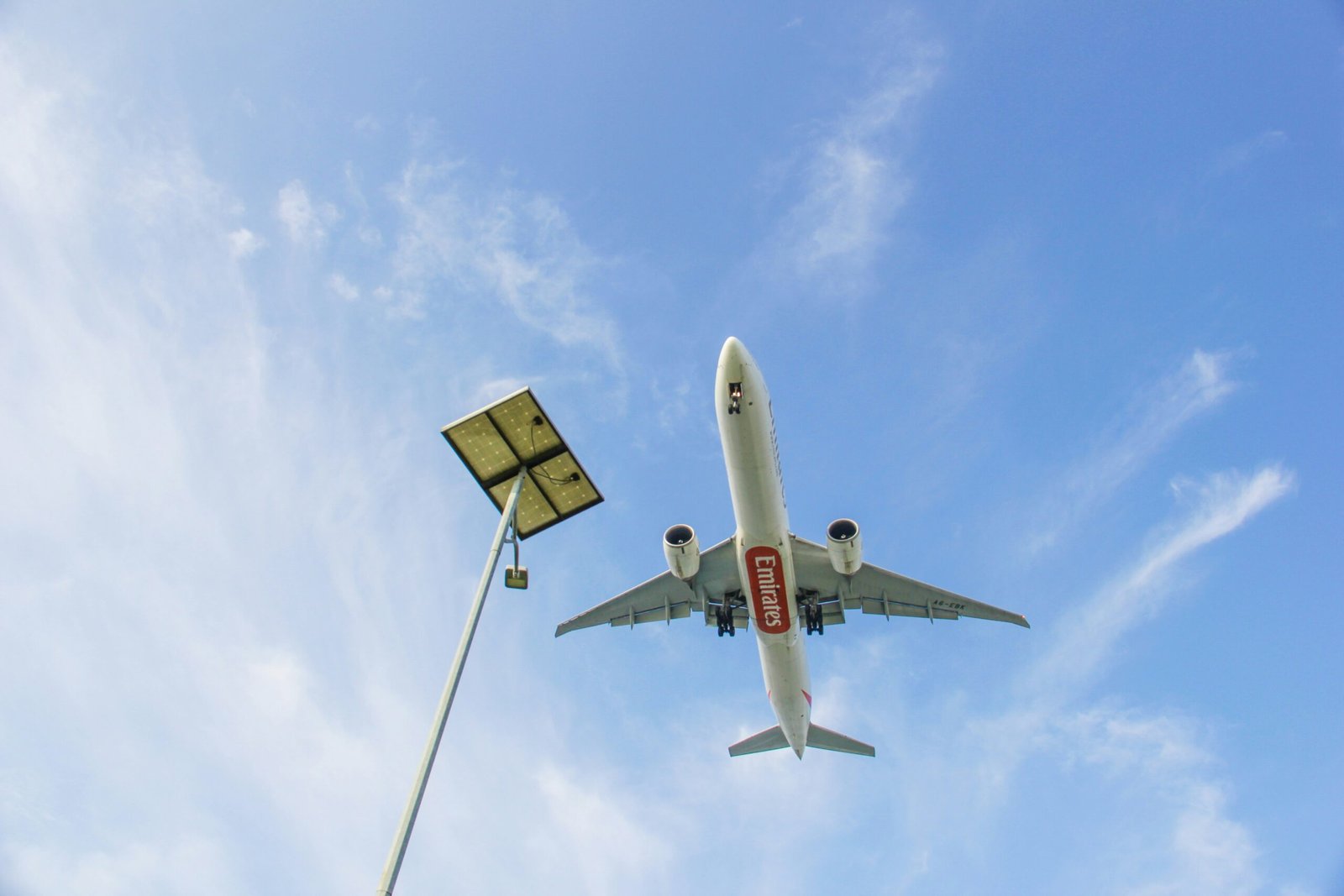 a large jetliner flying through a blue sky